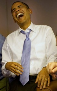 President Obama Laughs with Aides on Air Force One