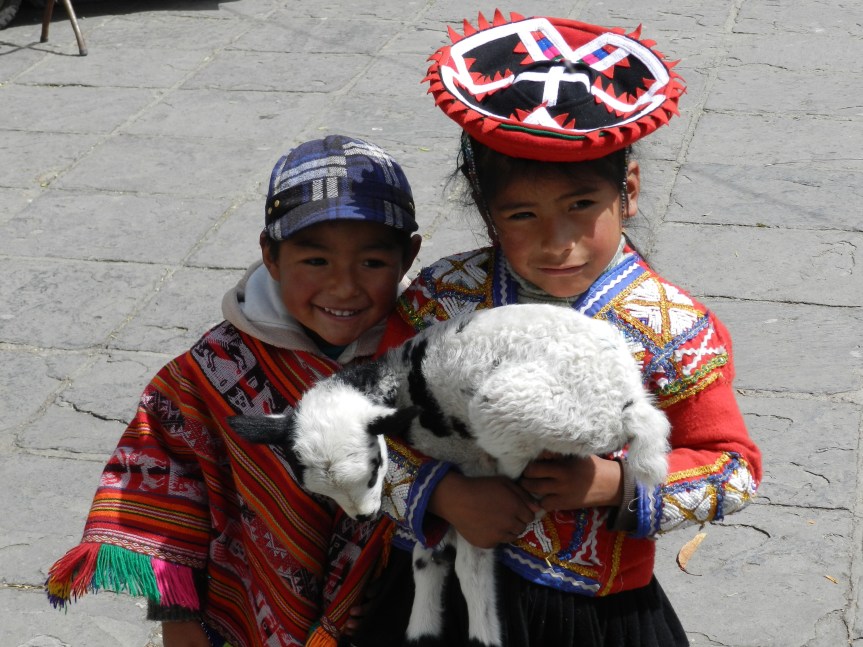 This is affected behavior for tourists, but damn they are cute! We had to pay them for the photo, and they turn the money over to their mother.